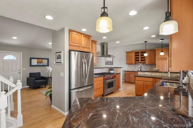 3785 E 134th Ct, Thornton, CO 80241 - kitchen with stainless steel appliances, wall chimney range hood, tasteful backsplash, light wood-type flooring, and open shelves