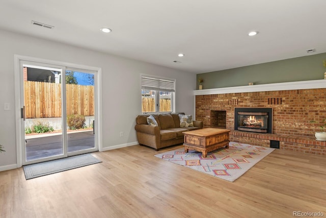 3785 E 134th Ct, Thornton, CO 80241 - living room with wood finished floors, a fireplace, and recessed lighting