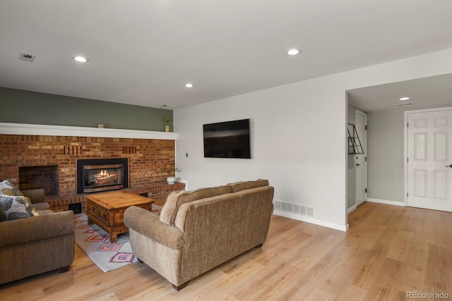 3785 E 134th Ct, Thornton, CO 80241 - living area with light wood-style floors, recessed lighting, and a fireplace