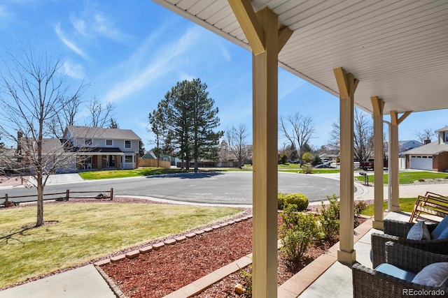 3785 E 134th Ct, Thornton, CO 80241 - covered porch with a residential view and a yard