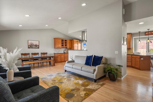 3785 E 134th Ct, Thornton, CO 80241 - living room with lofted ceiling, light wood-style flooring, and recessed lighting