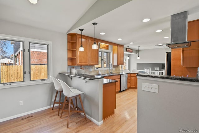 3785 E 134th Ct, Thornton, CO 80241 - kitchen featuring dishwasher, a peninsula, island exhaust hood, recessed lighting, and light wood-style floors