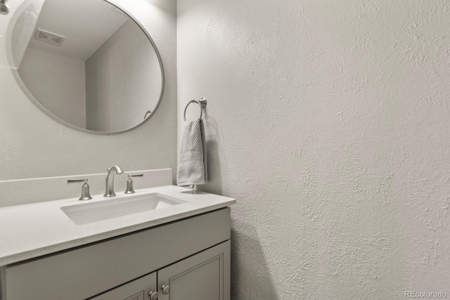 3785 E 134th Ct, Thornton, CO 80241 - bathroom featuring vanity and a textured wall