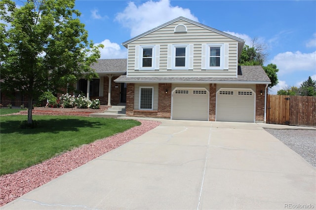 3785 E 134th Ct, Thornton, CO 80241 - tri-level home with brick siding, a shingled roof, concrete driveway, and a garage
