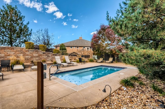 view of pool featuring a patio area