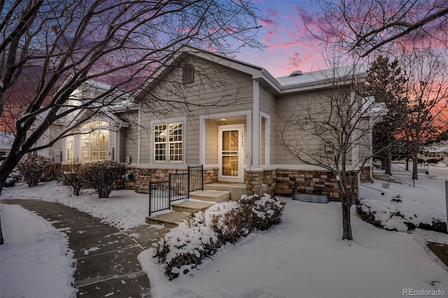 view of front facade featuring stone siding