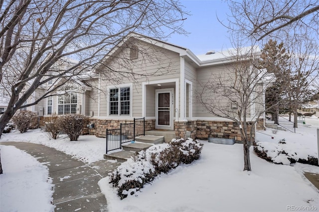 view of front of house featuring stone siding