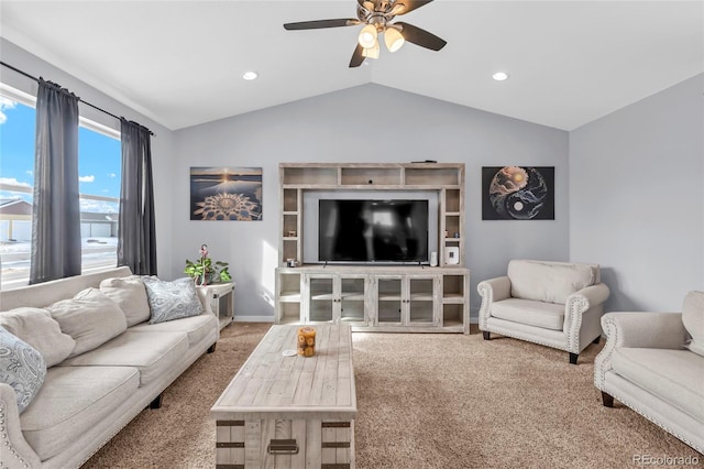 living room featuring vaulted ceiling, ceiling fan, and carpet