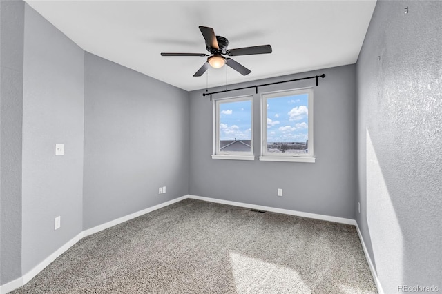 unfurnished room featuring carpet floors and ceiling fan