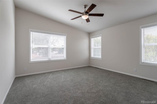 carpeted empty room featuring lofted ceiling and ceiling fan