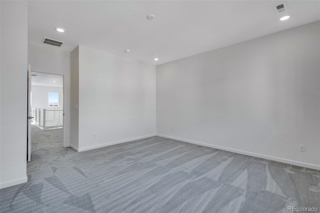 unfurnished room with carpet, baseboards, and recessed lighting