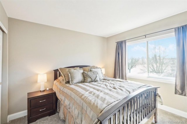 carpeted bedroom with baseboards