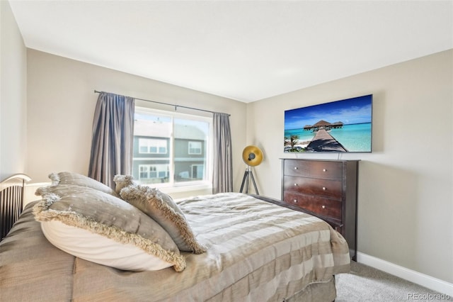 carpeted bedroom with baseboards