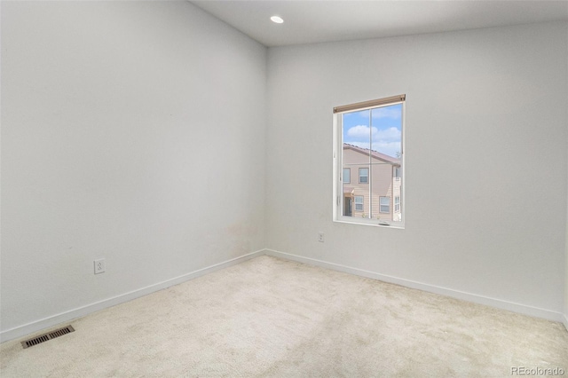 9757 Ash Ln, Thornton, CO 80229 - unfurnished room with baseboards, light colored carpet, and recessed lighting