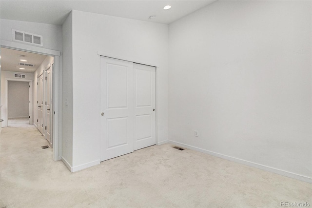 9757 Ash Ln, Thornton, CO 80229 - unfurnished bedroom with light colored carpet, baseboards, recessed lighting, and a closet