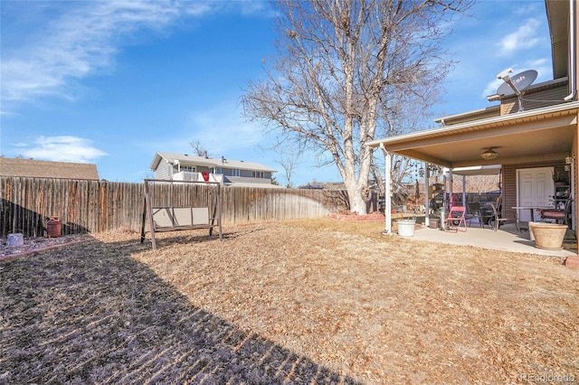 view of yard with ceiling fan and a patio area