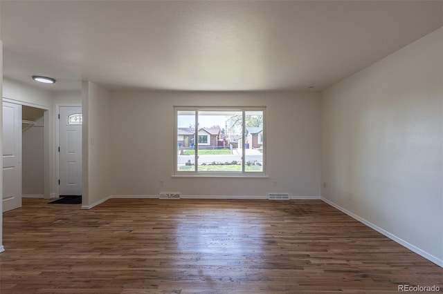 6013 W 62nd Ave, Arvada, CO 80033 - empty room featuring dark wood-style floors and baseboards