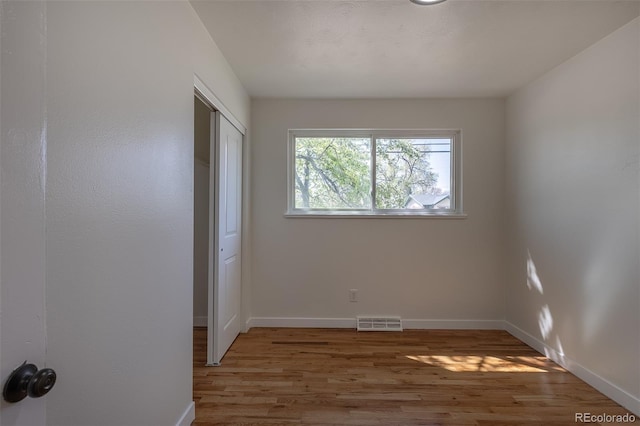 6013 W 62nd Ave, Arvada, CO 80033 - unfurnished bedroom with light wood-type flooring, baseboards, and a closet