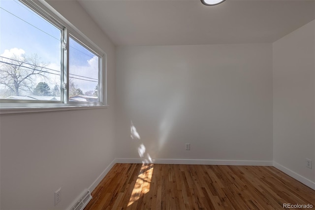 6013 W 62nd Ave, Arvada, CO 80033 - empty room with baseboards and wood finished floors