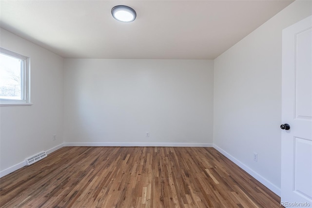 6013 W 62nd Ave, Arvada, CO 80033 - empty room with wood finished floors and baseboards