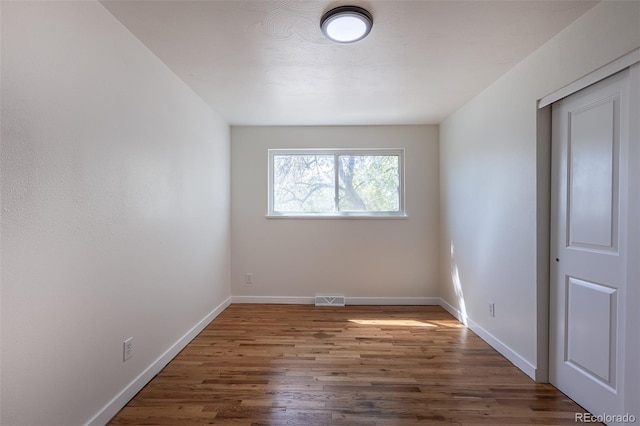 6013 W 62nd Ave, Arvada, CO 80033 - empty room featuring wood finished floors and baseboards