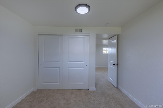 6013 W 62nd Ave, Arvada, CO 80033 - unfurnished bedroom featuring light carpet, baseboards, and a closet