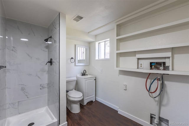 6013 W 62nd Ave, Arvada, CO 80033 - full bath with toilet, a shower stall, baseboards, wood finished floors, and a sink