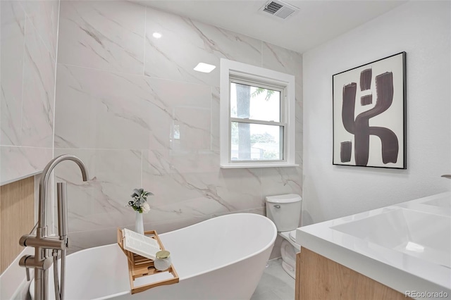 1360 W Custer Pl, Denver, CO 80223 - full bath with vanity, a freestanding tub, and tile walls