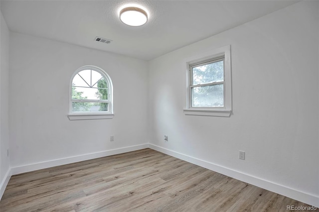 1360 W Custer Pl, Denver, CO 80223 - spare room featuring wood finished floors and baseboards