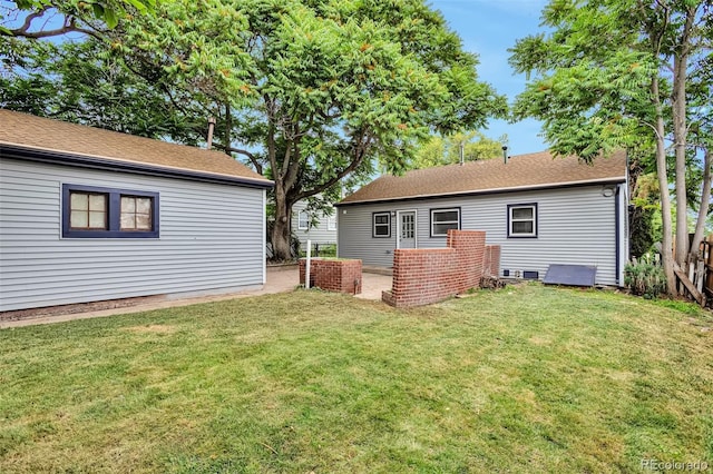 1360 W Custer Pl, Denver, CO 80223 - back of house featuring a yard and roof with shingles