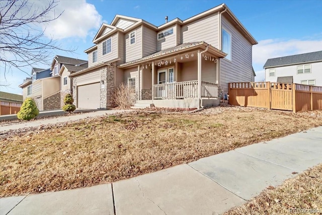 view of front of property with a porch and a garage