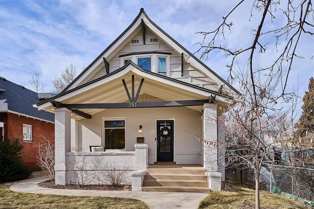 view of front of home featuring covered porch