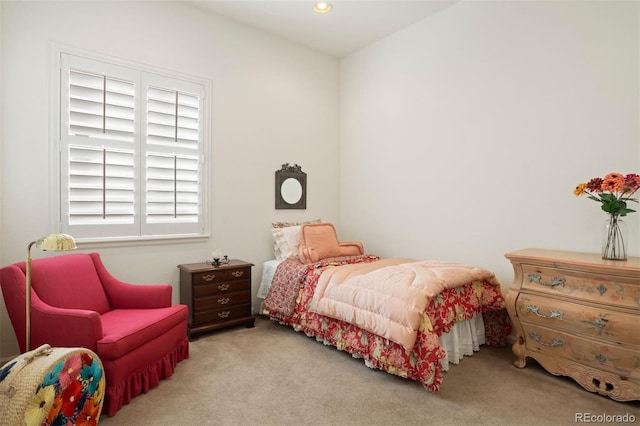 bedroom with light colored carpet