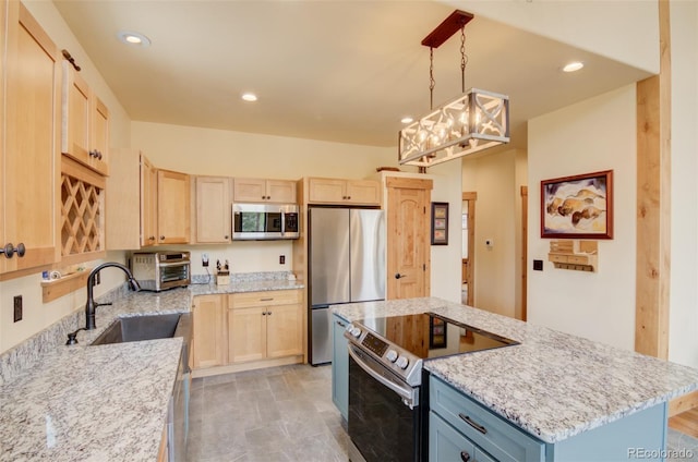 30490 Harvard Cir, Buena Vista, CO 81211 - kitchen with appliances with stainless steel finishes, light brown cabinetry, a sink, light stone counters, and recessed lighting