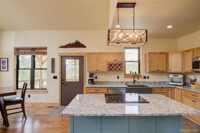 30490 Harvard Cir, Buena Vista, CO 81211 - kitchen featuring a sink, light brown cabinetry, a center island, light wood-style flooring, and recessed lighting