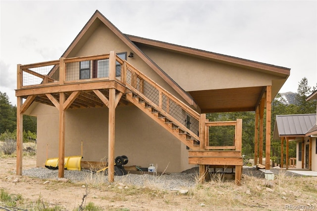 30490 Harvard Cir, Buena Vista, CO 81211 - back of house with stucco siding and a deck