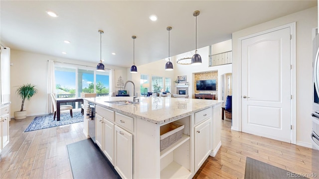 5932 Eldora St, Golden, CO 80403 - kitchen with a sink, open shelves, light wood-type flooring, healthy amount of natural light, and recessed lighting