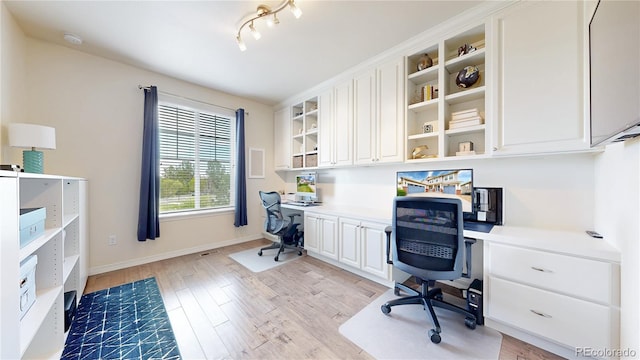 5932 Eldora St, Golden, CO 80403 - office with built in study area, light wood-style floors, and baseboards