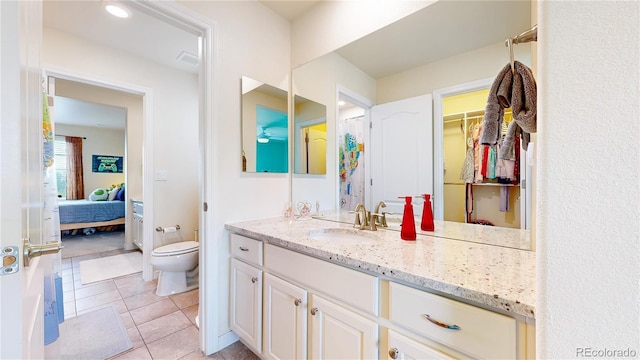 5932 Eldora St, Golden, CO 80403 - ensuite bathroom featuring vanity, toilet, and tile patterned flooring