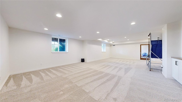 5932 Eldora St, Golden, CO 80403 - basement with light carpet, recessed lighting, and baseboards