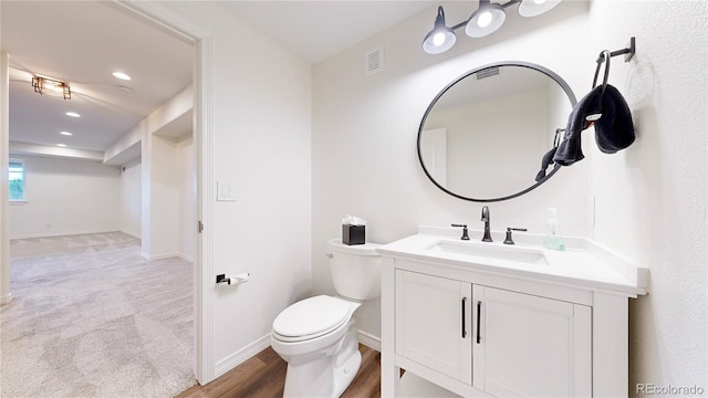 5932 Eldora St, Golden, CO 80403 - half bathroom featuring vanity, toilet, baseboards, and recessed lighting