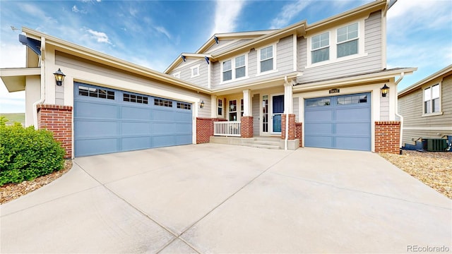 5932 Eldora St, Golden, CO 80403 - craftsman house with brick siding, concrete driveway, and central AC