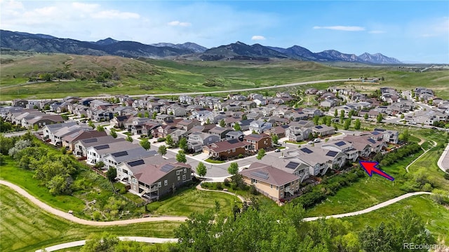 5932 Eldora St, Golden, CO 80403 - aerial overview of property's location featuring a mountain backdrop and nearby suburban area