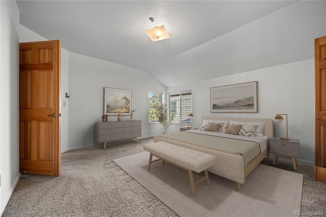 bedroom with baseboards, light carpet, a textured ceiling, and vaulted ceiling