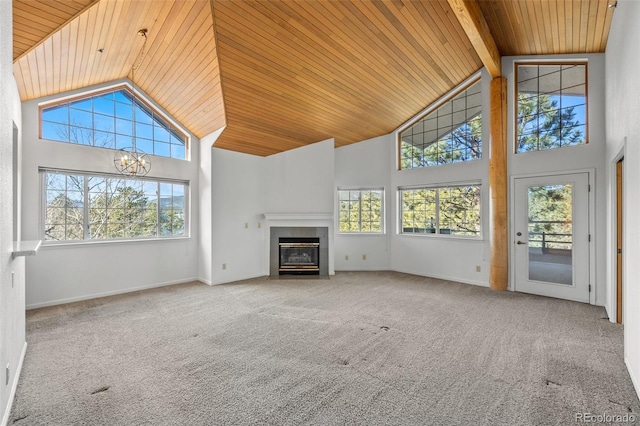 unfurnished living room featuring wooden ceiling, carpet flooring, and high vaulted ceiling