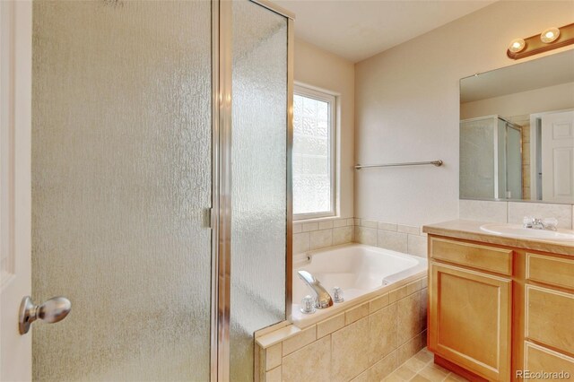 6836 Loudon St, Wellington, CO 80549 - full bath with a stall shower, vanity, and a bath