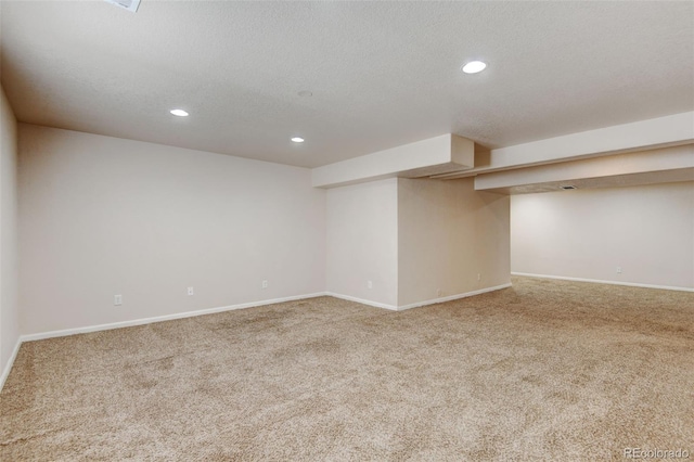 6836 Loudon St, Wellington, CO 80549 - finished below grade area with carpet, recessed lighting, and a textured ceiling