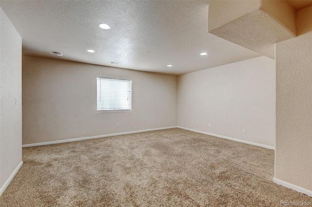 6836 Loudon St, Wellington, CO 80549 - unfurnished room featuring carpet flooring, recessed lighting, and a textured ceiling