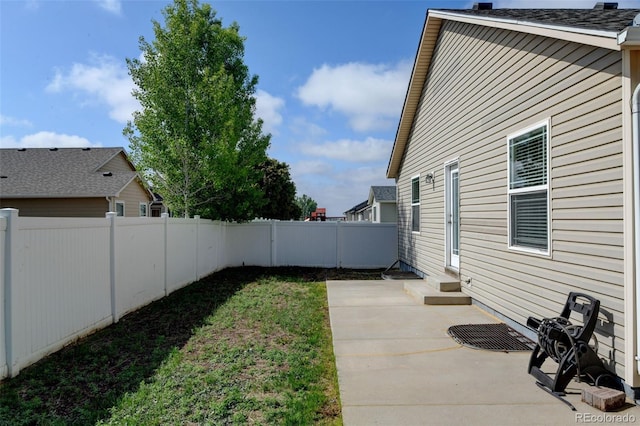 6836 Loudon St, Wellington, CO 80549 - fenced backyard featuring entry steps and a patio area