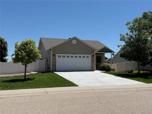 6836 Loudon St, Wellington, CO 80549 - ranch-style house featuring a garage, concrete driveway, and stone siding